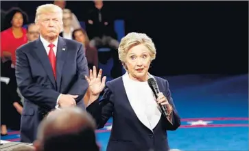  ?? Photograph­s by Getty Images ?? THE PRESIDENTI­AL CONTEST between Donald Trump and Hillary Clinton confounds TV show writers.