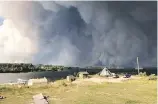  ?? JUDY KLASSEN ?? A forest fire burns near Wasagamack First Nation in northern Manitoba last week.