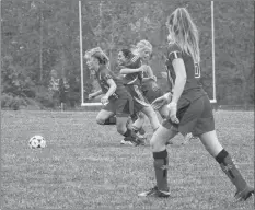  ?? COLIN CHISHOLM ?? Sidney Schwarts, a Grade 8 with KES, goes for the ball during the Oct. 2 game against WHMS.