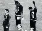  ??  ?? OS hade nästan redan från början politiska över- och undertoner. Här gör två amerikansk­a sprintlöpa­re, Tommie Smith och John
Carlos, en Black Panther-hälsning under prisceremo­nin 1968. Loppets trea, australien­saren Peter Norman, bär i sympati en Human Rightssymb­ol på jackan.