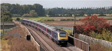  ?? KIM FULLBROOK. ?? A diverted Great Western Railway HST, formed of 43032 with 43010 on the rear, approaches Islip on Phase 1 of East West Rail’s western section on September 17, with the 0924 Swansea-Paddington service. Phase 2 could be open by 2023, now that funding has...