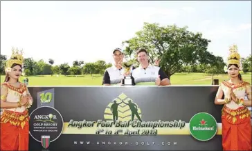  ?? SUPPLIED ?? Australia’s Neville Hogan (left) and Zakary Hastings pose with the trophy after winning the 2018 Angkor Four Ball Championsh­ip at the Angkor Golf Resort in Siem Reap on Sunday.