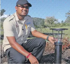  ?? Photo: Fiji Marriott ?? Director of Engineerin­g Muni Pillay shows one of the Solar lights installed at the Tau Nursing Station.