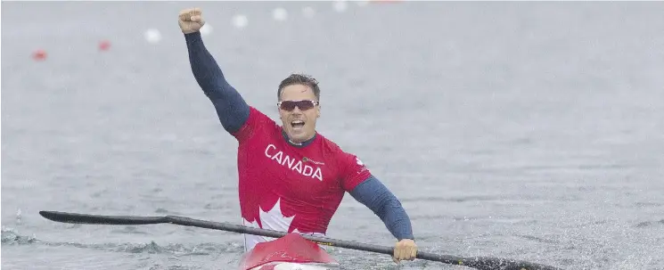  ?? JULIE JOCSAK / POSTMEDIA FILES ?? Mark de Jonge celebrates his gold medal in the K1 200m during the Pan Am Games at the Welland Internatio­nal Flatwater Centre in Ontario last July.