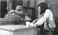  ?? BILL PIERCE NYT ?? Spinney, left, with Jim Henson. Henson recruited him to “Sesame Street” after watching the puppeteer attempt to perform a multimedia show that went awry.