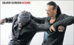  ??  ?? CRIMINAL CESSPIT: Things get ugly between Tony Kgoroge, left, and Quentin Chong in ‘Cold Harbour’