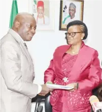  ??  ?? (L-R) The incoming Permanent Secretary, Federal Ministry of Labour and Employment, Mr. William Nwankwo Alo, receiving the hand over note from the outgoing Permanent Secretary, Mrs. Ibukun Odusote