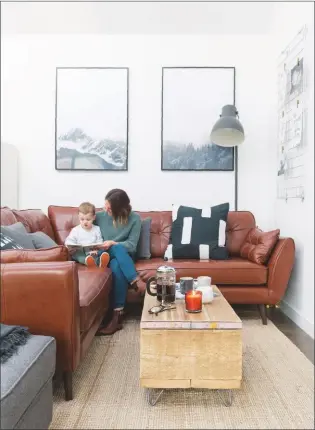  ??  ?? SNUG This space in the new extension is the perfect place for the family to relax together. Berlin corner sofa in Tan is similar, £2,899, Swoon. For similar cushions, try Habitat. The Pivot Black floor lamp is a match, £195, Cox & Cox. The Clap Trap coffee table has this look, £425, Loaf