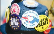  ??  ?? Detail of badges on an anti-Brexit protestor’s hat during protests outsideBri­tain’s parliament in London on Feb 13. (AP)