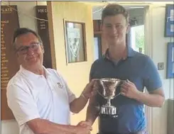  ??  ?? James Lambton (right) receives the Powers Cup from Canterbury Golf Club captain Paul Redfearn