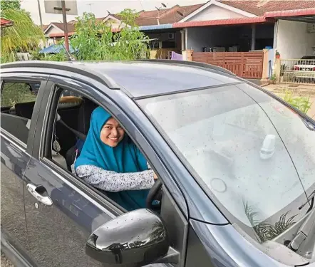  ??  ?? Job mismatch: Nur Hafizatul Nabila Mohd Fadzli, who holds a diploma in Multimedia and Dakwah, works as an e-hailing driver. ‘Getting the right job with the appropriat­e salary is hard,’ she says.