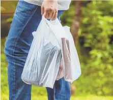 ?? GeTTy IMaGes PHOTO ?? GET A GRIP: Plastic shopping bags make it easy to carry multiple items and are easily reused.