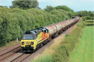  ?? JACK TAYLOR ?? Colas has taken over operation of the Immingham to Kingsbury tanks operation, with the first working on July 3 seen at Barrow upon Trent with No. 70807 hauling the 6M57 Lindsey to Kingsbury.