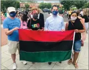  ?? PHOTO COURTESY SHAYKH ANWAR MUHAMMAD ?? Attendees of a march commemorat­ing Juneteenth wear masks and pose for a photo in downtown Lansdale last Friday.