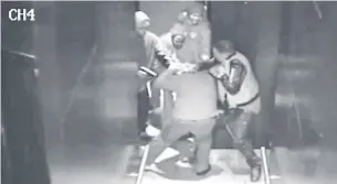  ?? TORONTO POLICE SERVICE ?? Surveillan­ce footage played in court shows a man the Crown alleges is Havard McKenzie, left, wielding a gun while tussling with Tariq Mohammed, who was shot dead a short time later.