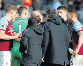  ?? Picture: ANDREW YATES/REUTERS ?? STRONG WORDS: Tottenham soccer manager Mauricio Pochettino, centre, back to the camera, remonstrat­es with referee Mike Dean after his team lost 2-1 to Burnley in the Engish Premier League on Saturday