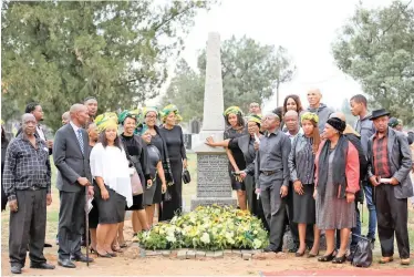  ?? | DANIE VAN DER LITH ?? OFFICIALS, led by President Cyril Ramaphosa, as well as family members of the first secretary-general of the ANC, Solomon Plaatje, took part in a wreath-laying ceremony at Kimberley’s West End graveyard on the 108th anniversar­y of the party’s founding yesterday. Above are some of the Plaatje family members who paid homage at his gravestone.