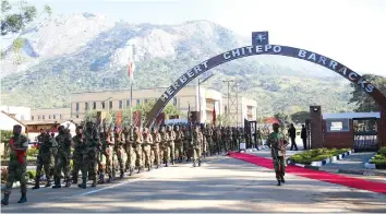  ?? Picture: Believe Nyakudjara ?? Members of the ZNA march at the entrance of 3 Infantry Brigade which was renamed to Herbert Chitepo Barracks in Mutare yesterday.