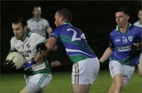  ??  ?? Craig Doyle of Glynn-Barntown tackles Robbie Barron (St. James’) as Rioghan Crosbie awaits the outcome.