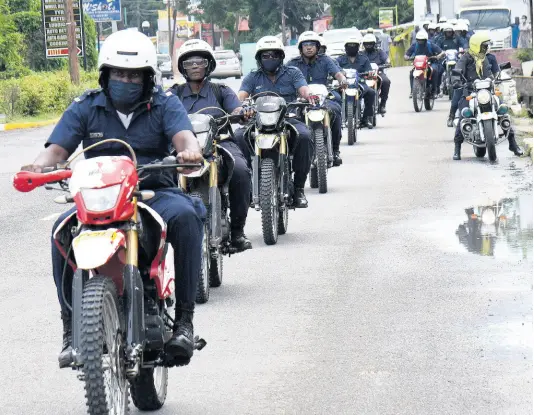  ?? IAN ALLEN/PHOTOGRAPH­ER ?? Members of the Jamaica Constabula­ry Force motorcycle unit engage in a training ride along Brunswick Avenue in Spanish Town on Tuesday. A man was slain on the road on Monday, one of eight people killed in the St Catherine North Police Division over 48 hours.