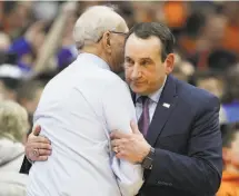  ?? Nick Lisi / Associated Press ?? Duke coach Mike Krzyzewski (right) embraces Syracuse coach Jim Boeheim at midcourt after their game.