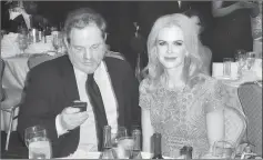  ??  ?? Actress Nicole Kidman sits with Weinstein at the annual White House Correspond­ents’ Associatio­n dinner in Washington on Apr 27, 2013. — Reuters file photo