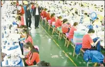  ??  ?? In this image made from undated, file video footage run by China’s CCTVvia AP Video, Muslim trainees work in a garment factory at the Hotan Vocational
Education and Training Center in Hotan, Xinjiang, northwest China. (AP)