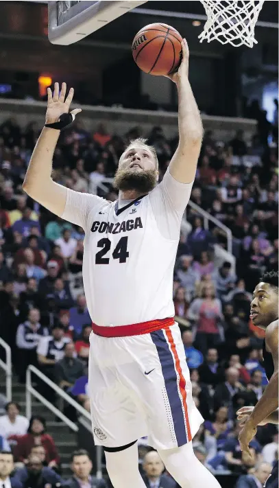  ?? — THE ASSOCIATED PRESS FILES ?? Przemek Karnowski and the Gonzaga Bulldogs will cut down the nets as national champions on Monday, according to a coach whose team faced all the participan­ts in the Final Four this season.