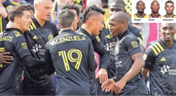  ?? ADAM CAIRNS/COLUMBUS DISPATCH ?? Lucas Zelarayan is mobbed by Crew teammates, including Darlington Nagbe, right, after scoring the only goal in a season-opening win over New York City at Mapfre Stadium.