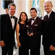  ??  ?? Dr. Tran and wife Thao Tran pictured with Governor Brian Kemp and Chancellor Dr. Steve Wrigley