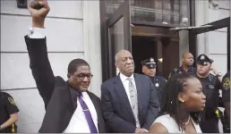  ?? Associated Press ?? Andrew Wyatt raises his fist as Bill Cosby exits the Montgomery County Courthouse after a mistrial was declared in Norristown, Pa., on Saturday.