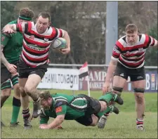  ??  ?? Paddy Waters charging forward as Tom Ryan awaits the outcome.