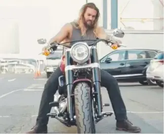  ??  ?? Jason Momoa and his new Harley Davidson at Village Roadshow Studios.