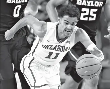  ?? Associated Press ?? ■ In this Jan. 30 file photo, Oklahoma guard Trae Young (11) heads up the court with a steal against Baylor during the second half of an NCAA college basketball game in Norman, Okla. Young is projected as a likely top-10 pick in next week's NBA draft.