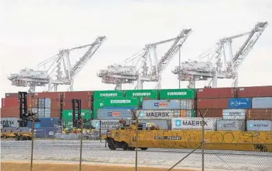  ?? ULYSSES MUÑOZ/BALTIMORE SUN PHOTOS ?? Container cranes at the Port of Baltimore are crucial to the steady flow of cargo through the port.