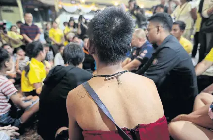  ?? PATIPAT JANTHONG ?? Education officials speak to homeless youngsters in Bangkok last year. Thailand has allowed more than a million young people to fall through the cracks, with no education, no jobs, no training and no future.