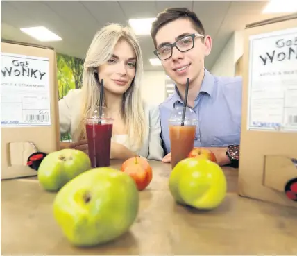  ??  ?? &gt; Karina Sudenyte, originally from Lithuania, and Maciek Kacprzyk, originally from Poland, have set up a natural juice business called Wonky Fruit