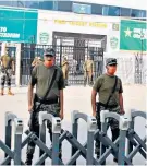  ?? ?? Facing a threat: Security personnel at the Rawalpindi stadium for the cancelled game