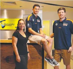  ?? Picture: BRENDAN RADKE ?? BACK TO IT: CQU assistant vice-chancellor Jodie Duignan-George with Shaun Bruce and Cameron Gliddon.