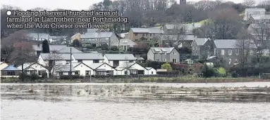  ??  ?? Flooding of several hundred acres of farmland at Llanfrothe­n, near Porthmadog, when the Afon Croesor overflowed