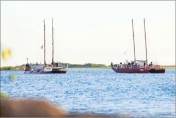  ?? ?? Polynesian voyaging canoes Hokule‘a and Hikianalia return to Oahu on Thursday evening after traveling to Tahiti as part of the two-month Kealaikahi­ki Voyage.