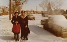  ??  ?? The Trinh family during their first winter in Lethbridge, Alta.