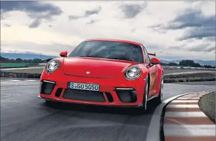  ?? Porsche ?? AT ROOT, Porsche’s 2018 911 GT3 — featuring engine upgrades — is an extremely modern version of a very traditiona­l automobile.