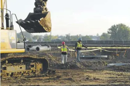  ?? Photos by RJ Sangosti, The Denver Post ?? Crews work last week on the Denver Premium Outlets, which is set to open in Thornton in 2018. It is part of the boom in new developmen­t along the Interstate 25 corridor.