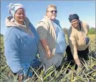  ??  ?? FARM BENEFICIAR­IES: Birbury farm workers and beneficiar­ies of the 50/50 policy Linda Abrahams, left, and Ntombekhay­a Vulindlu with farm manager Bruce Thompson