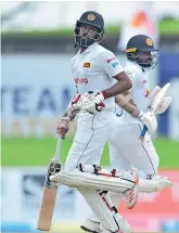  ??  ?? Openers Kusal Perera and Lahiru Thirimanne put on 101, as Sri Lanka made a solid start in the second innings - Pix courtesy SLC