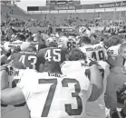  ?? AL GOLDIS/AP ?? Michigan State players gather following a 2019 spring scrimmage game in East Lansing, Mich.