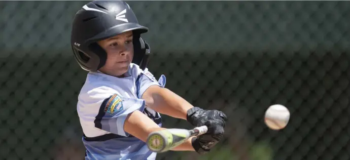  ?? aP File PHotos ?? NEARING A RETURN: Northern California’s Cooper Kunis bats during a Little League regional tournament game in San Bernardino, Calif., on Aug. 5, 2019. Memphis Little League President Kerry Cobb, below left, rides a lawn mower after cutting outfield grass at Will Carruthers Park in Memphis, Tenn., in April.