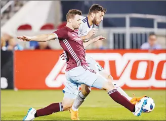  ??  ?? Colorado Rapids defender Tommy Smith (front), deflects a shot by Chicago Fire forward Elliot Collier during the
second half of an MLS soccer match on June 13, in Commerce City, Colo. (AP)