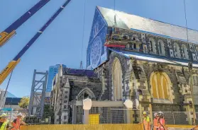  ?? Nick Perry / Associated Press ?? Constructi­on workers continue to repair damage to Christ Church Cathedral a decade after a major earthquake devastated the region in New Zealand.